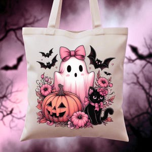 A whimsical printable illustration of a cute pink ghost with a pink bow, a black cat with a pink bow, a pumpkin with a jack-o-lantern face, and pink flowers. Perfect for personalizing Halloween t-shirts, hoodies, sweatshirts, tote bags, tumblers, and mugs.