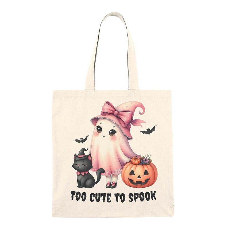 Adorable Halloween-themed illustration featuring a cute pink ghost wearing a pink witch hat with a bow, accompanied by a black cat in a miniature witch hat.  A smiling jack-o'-lantern adds to the festive scene.  The image is a 300 DPI PNG with a transparent background.  Perfect for printong on trick-or-treat bags.