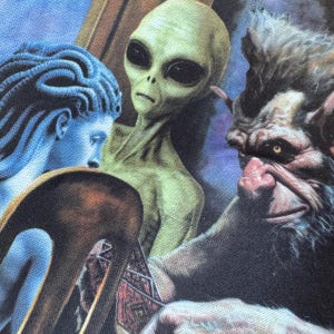 detail of computer case with medusa, extraterrestrial, and troll