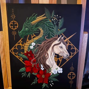 Shot of the original canvas that is 11x14 feature gothic architectural details in the background with a green dragon, beige unicorn and floral details.