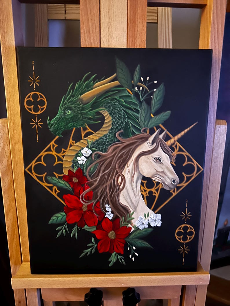 Shot of the original canvas that is 11x14 feature gothic architectural details in the background with a green dragon, beige unicorn and floral details.