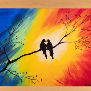 May include: Colorful abstract painting of two birds silhouetted on a branch, forming a heart shape with their beaks. The background transitions from blue to yellow to red. The artwork is signed in the lower right corner.