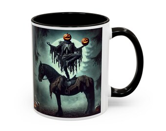 May include: White ceramic mug with a black interior and handle. The mug features a Halloween-themed illustration of a skeleton with a pumpkin head riding a horse. The background includes a full moon and trees.