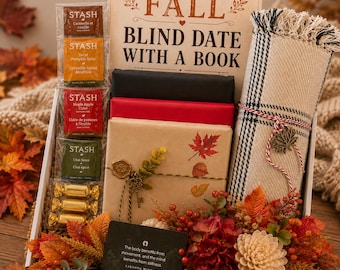 May include: A gift box containing a sign reading FALL BLIND DATE WITH A BOOK, four Stash tea packets, three gold-wrapped candies, a black book, a red book, a brown paper-wrapped book with a wax seal and key charm, and a plaid throw blanket.