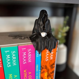 Suriel bokhylledekoration Suriel tebokhylledekoration Liemannen sittande bokhylla med tekoppfigur bild 4