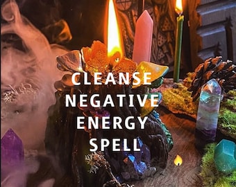 May include: A candle holder with a burning candle, crystals, and the text "CLEANSE NEGATIVE ENERGY SPELL." The candle holder is surrounded by other candles, crystals, and moss. Smoke is rising from the candle holder.