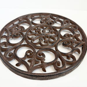 Antique 10” cast iron vintage kitchen hot plate trivet