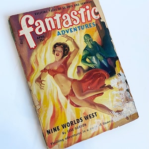 May include: Vintage "Fantastic Adventures" magazine cover. The cover art features a woman in a red outfit amidst flames, with a green-skinned figure. The title "Nine Worlds West" is visible, along with the text "Exciting Tales of Science and Fantasy."