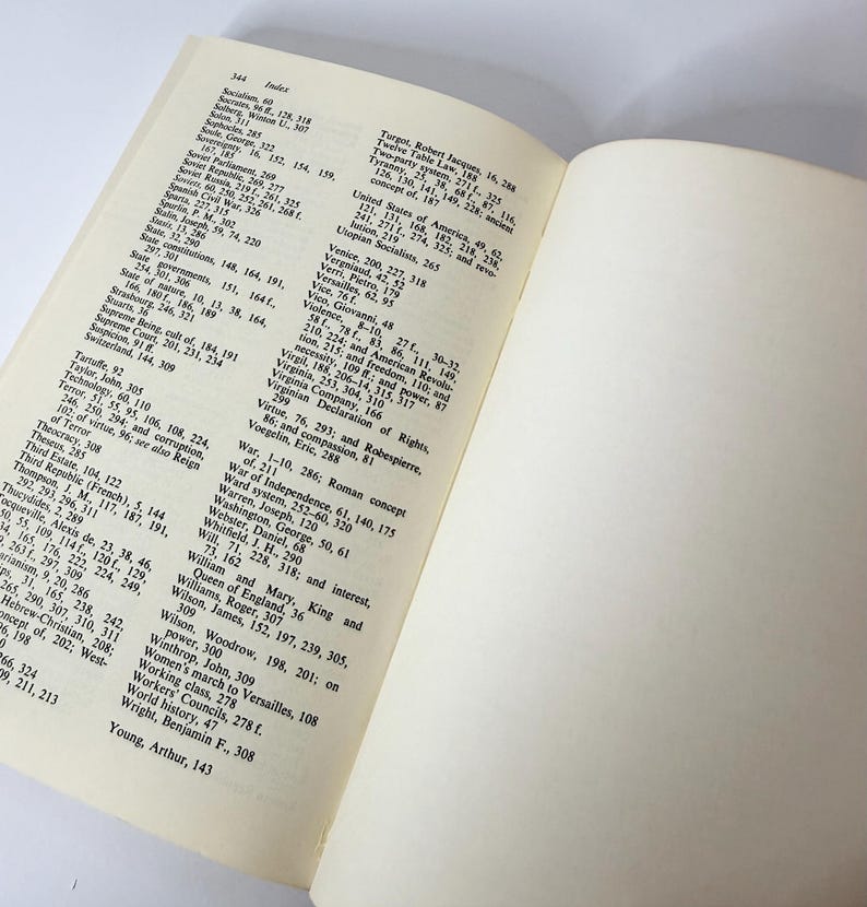 May include: An open book showing page 344, which contains an alphabetical index of historical terms and names printed in black ink on off-white paper. The left page features columns of text, while the right page is blank and cream-colored.