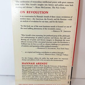 May include: The back cover of the book On Revolution by Hannah Arendt, published by The Viking Press. The cream-colored cover features red and black text, including reviews from The New Yorker, The New York Times, and Chicago Tribune.