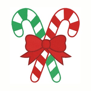 May include: Two red and green candy canes are crossed over each other and tied together with a red bow.