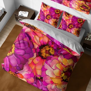 May include: A pink and orange floral duvet cover with a large, vibrant flower pattern. The duvet cover is made of soft, comfortable fabric and features a unique, artistic design.