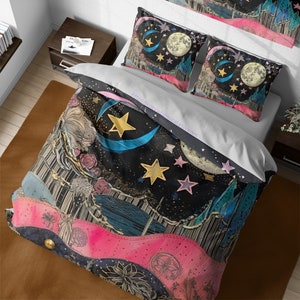 May include: A black duvet cover with a whimsical design featuring a crescent moon, stars, and a pink and blue watercolor background. The duvet cover is shown on a bed with two matching pillowcases.