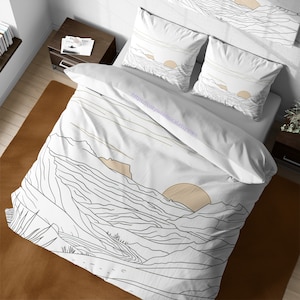 May include: White duvet cover with a black and white line drawing of mountains and a sun. The duvet cover has a white background with a subtle pattern of thin lines.