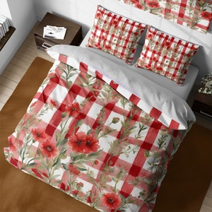 May include: Red and white gingham duvet cover with a watercolour floral pattern featuring red poppies. The duvet cover is shown on a bed with matching pillowcases.