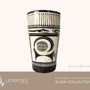 May include: A tall, cylindrical Susa beaker with black and white geometric designs. The upper portion features vertical lines, while the body displays a circular motif with arrows. The base and rim are outlined in black.