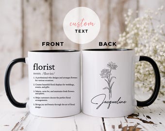 May include: White ceramic mug with a black handle and rim. The front of the mug features the definition of "florist" in black text. The back of the mug has a floral illustration and the name "Jacqueline" in script.