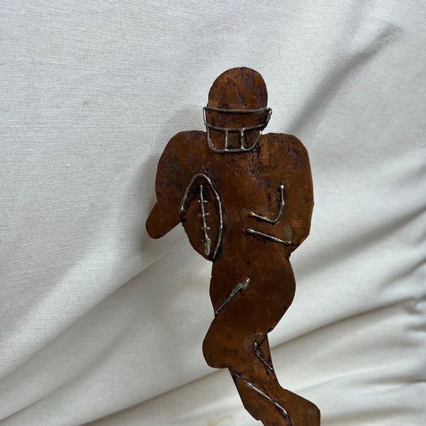 American football player copper statue