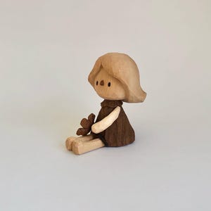 Handmade, wooden carved,  The Lazy Little One Holding a Flower