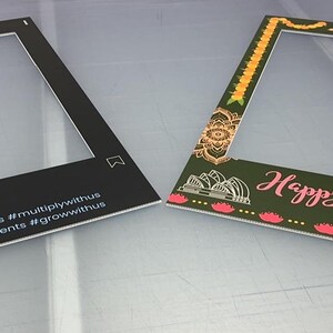 May include: Two photo booth frames. The first frame is black with white text that reads "InvestPlus.au #data-driven #informedinvestments #forsmartinvestors #multiplywithus #growwithus". The second frame is green with yellow, pink, and white accents. The text reads "Happy Diwali 2021".
