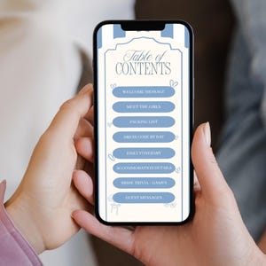 Op de afbeelding: Een smartphone met een "Inhoudsopgave" voor een bruidsevenement. Het scherm heeft een cr&egrave;mekleurige achtergrond met blauwe accenten en een lijst met onderwerpen zoals "Welkomstbericht" en "Paklijst."