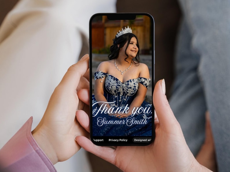 May include: A smartphone displays a photo of a woman in a formal gown and tiara. The navy blue dress has silver embellishments. The text "Thank you, Summer Smith" is written in elegant script across the image.
