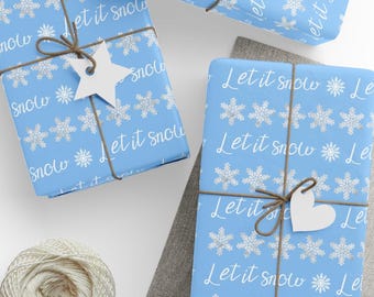 May include: Several wrapped gifts with light blue paper featuring white snowflakes and the text "Let it snow." Each package is tied with twine and a white paper tag. A ball of twine is visible in the lower left corner.