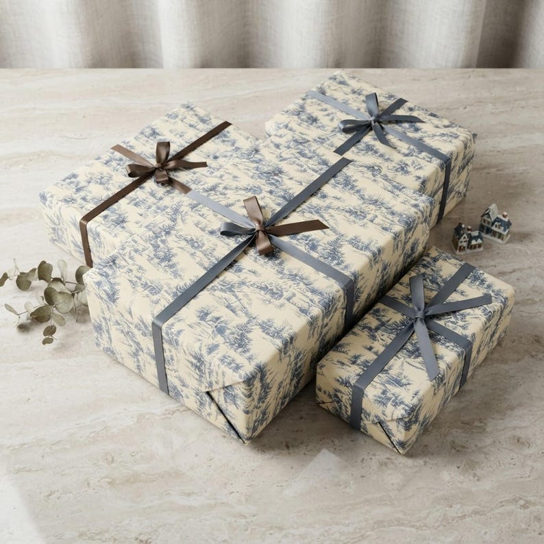 Blue Toile Winter Village Christmas Gift Wrap Rolls shown in an AI-generated listing photo