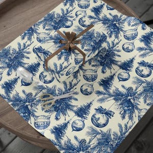Blue Toile Christmas Gift Wrap with Vintage Ornaments, Pinecones, and Winter Trees for Elegant Holiday Present Wrapping