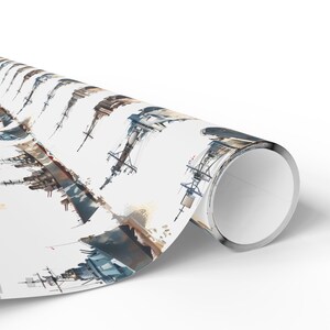 A single angled roll of wrapping paper featuring a repeating watercolor illustration of warships on a white background.
