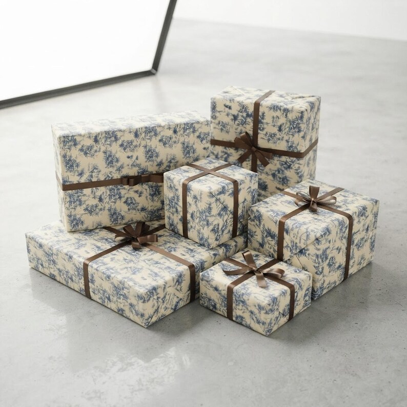 Blue Toile Winter Village Christmas Gift Wrap Rolls shown in an AI-generated listing photo