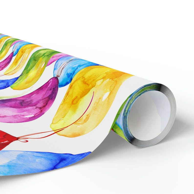 A single roll of wrapping paper featuring a watercolor pattern of colorful balloons against a white background.