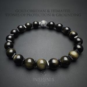 Puede incluir: Una pulsera de cuentas con piedras redondas de obsidiana dorada y hematita metálica alternadas, con una cuenta plateada texturizada. El texto dice: GOLD OBSIDIAN & HEMATITE STONES OF PROTECTION & GROUNDING e INSIGNIS.