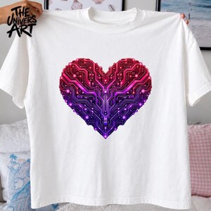May include: A white short-sleeved t-shirt featuring a large heart-shaped graphic composed of a red, pink, and purple circuit board pattern. The text "THE UNIVERS ART" is printed in black in the upper left corner of the shirt fabric.