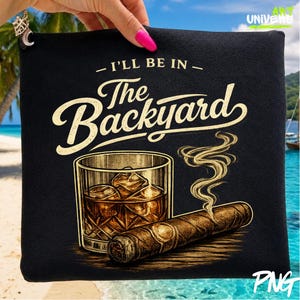 May include: A black fabric pouch featuring a graphic print of a glass of amber liquid with ice cubes and a lit cigar with rising smoke. The text "I'LL BE IN The Backyard" is printed in a cream-coloured script and serif font above the illustration.