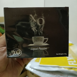 May include: Black and silver packaging for Java XO Liquid Passion coffee with a white cup of coffee and steam rising from it. The packaging has the text "Java XO Liquid Passion" and "Net Weight: 25g".