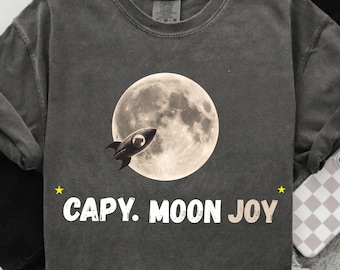 Capibara Moon Joy PNG, Lindo diseño de cohete retro de capibara, Gráfico estético lunar, Clip art divertido de animales espaciales, PNG para sublimación de camisetas
