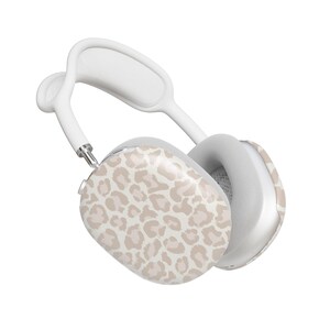 May include: White wireless headphones with a beige leopard print design on one earcup.