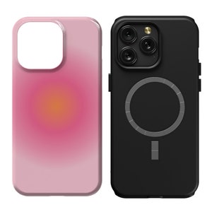 K&ouml;nnte beinhalten: Zwei Handyh&uuml;llen, eine rosa mit einem Farbverlauf und eine schwarze mit einem silbernen Ring und einem silbernen Balken.