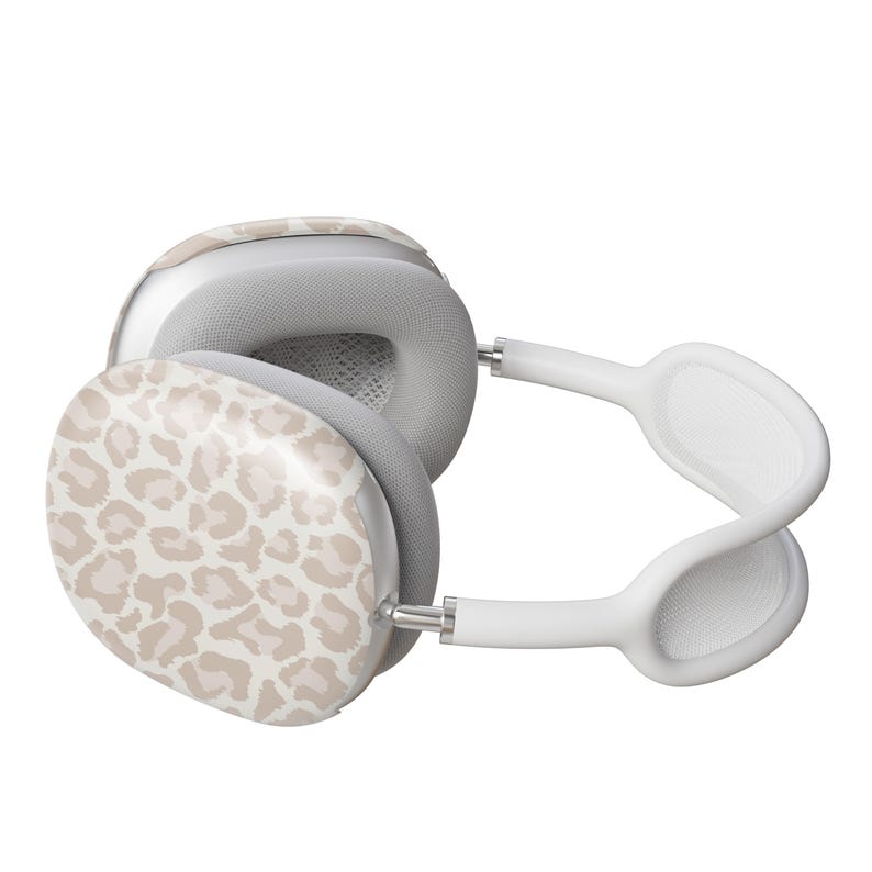 May include: White wireless headphones with a leopard print design on one earcup.