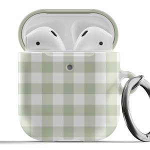 May include: An open, light green and white gingham patterned AirPods case with a silver carabiner clip. The case holds two white AirPods. The top of the case is light green.