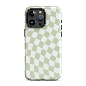 May include: A smartphone case with a green and white checkered pattern. The case has a glossy finish and a black camera module with three lenses. The case is designed to fit a smartphone.