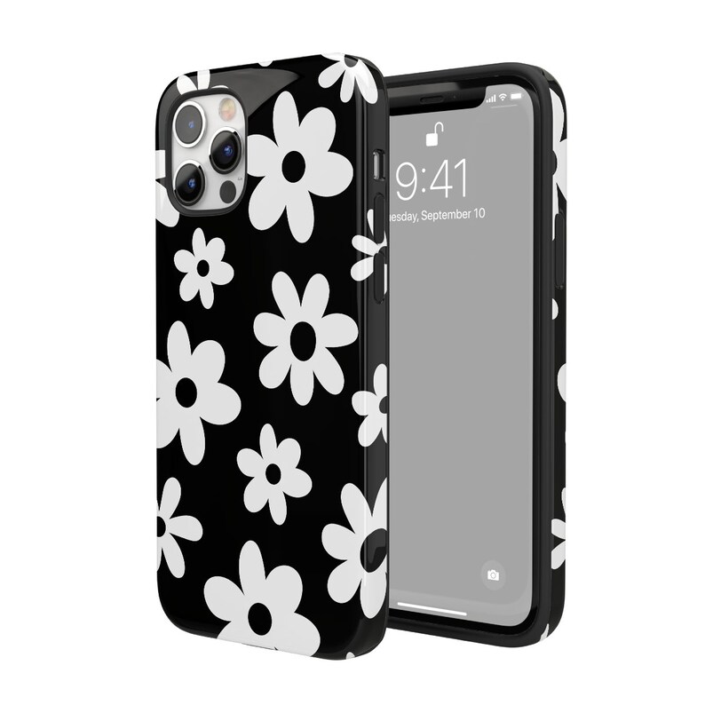 Może przedstawiać: Czarne etui na telefon z wzorem białych stokrotek. Etui ma przezroczyste plecy i czarną ramkę. Ekran telefonu pokazuje godzinę 9:41 i datę wtorek, 10 września.