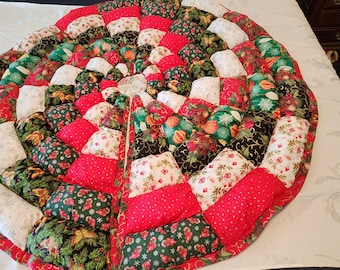 This is a handmade 55 inch puffy Christmas Tree Skirt.