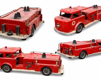 May include: Four vintage red toy fire trucks with black and silver details are displayed against a white background. Each truck has a different design, including ladders, sirens, and the Star logo. The trucks are made of metal and have black tires.