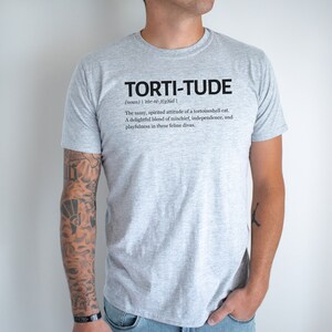 torti-tude definition t-shirt, tortoiseshell cat lover shirt,
cat lover gift, funny cat shirt, tortoiseshell cat apparel, pet owner t-shirt, cat lover definition shirt, tortoiseshell cat pride, torti-tude apparel