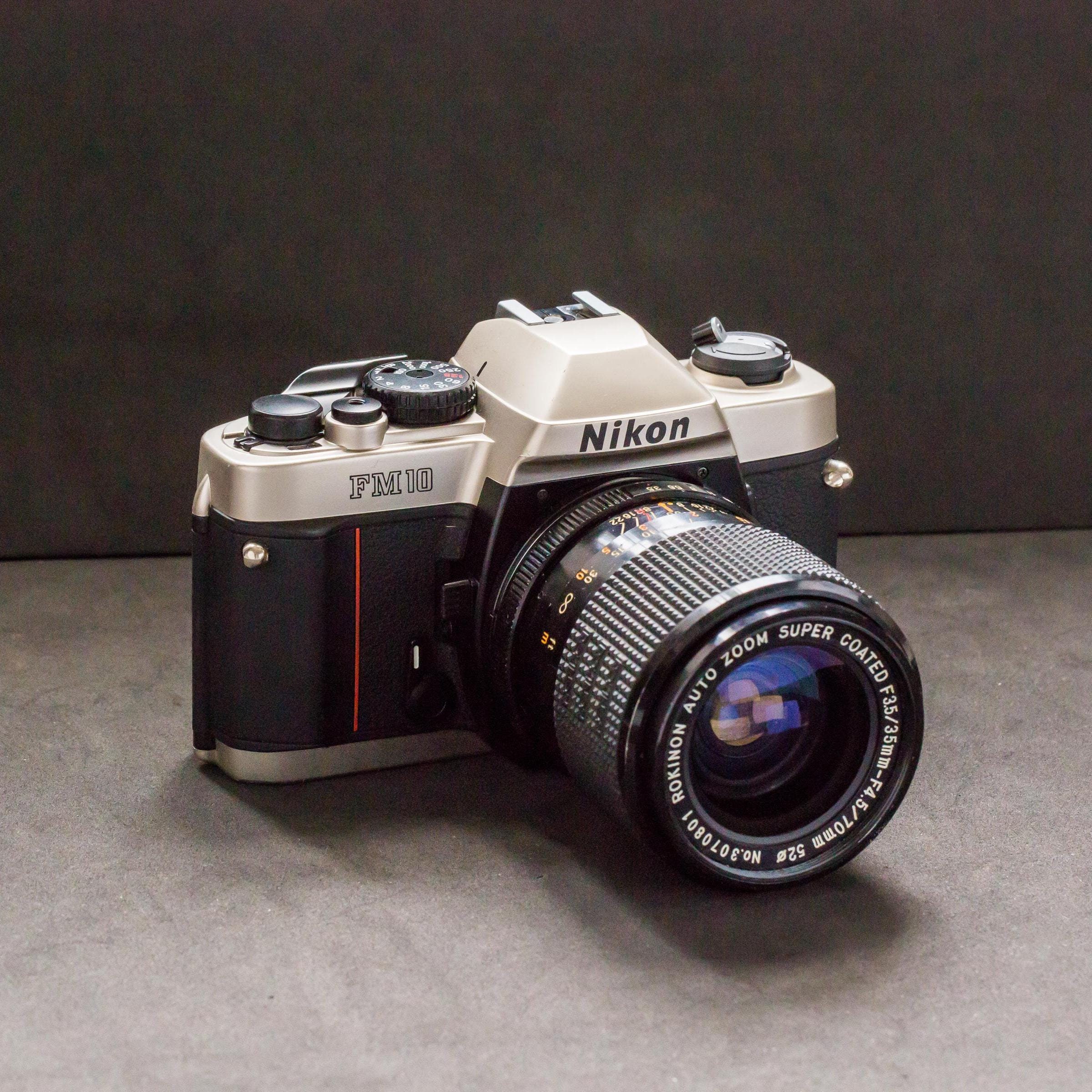 Nikon FM10 35mm Manual Film Camera With 35-70mm Rokinon Lens
