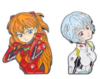 May include: Two anime-style enamel pins. One pin shows a character with orange hair in a red outfit. The other pin depicts a character with light blue hair in a white outfit with yellow accents. Both pins have detailed facial features.