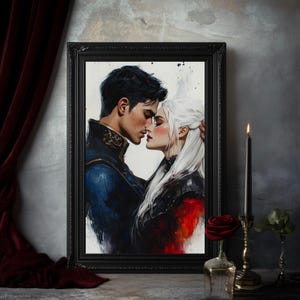 May include: A framed art print depicts a romantic scene of a couple embracing. The man wears a blue and gold jacket, while the woman has white hair and a black outfit. A red rose in a glass vase and a lit black candle are in the foreground.