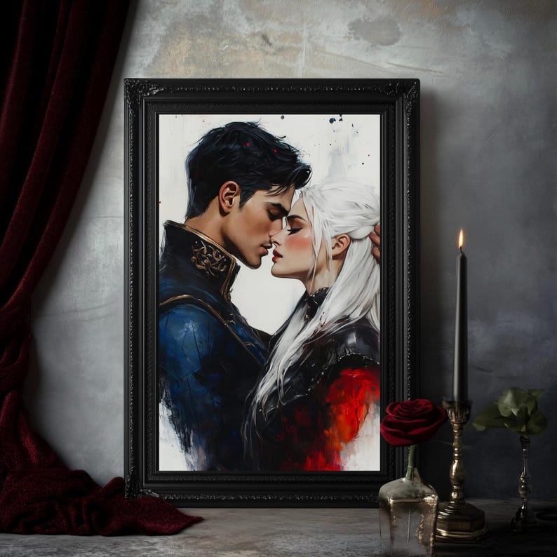 May include: A framed art print depicts a romantic scene of a couple embracing. The man wears a blue and gold jacket, while the woman has white hair and a black outfit. A red rose in a glass vase and a lit black candle are in the foreground.